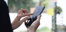 Image of person using mobile phone
